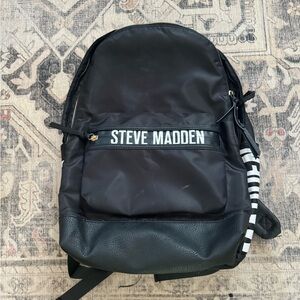 backpack,front zipper pocket,2 inside large pockets, detachable pouch.